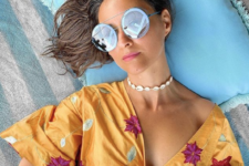 a bright island or tropical look accented with pastel blue sunglasses with F monograms for Fendi
