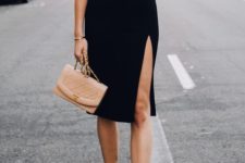 a chic black sheath knee dress with a slit, tan minimalist heels and a blush bag for a party look