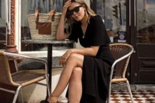 a cool summer look with a black midi wrap dress, black sporty sandals, a woven bag is great