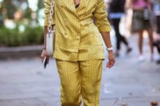 a mustard printed pajamas suit, white shoes and a white bag on chain for a wow look
