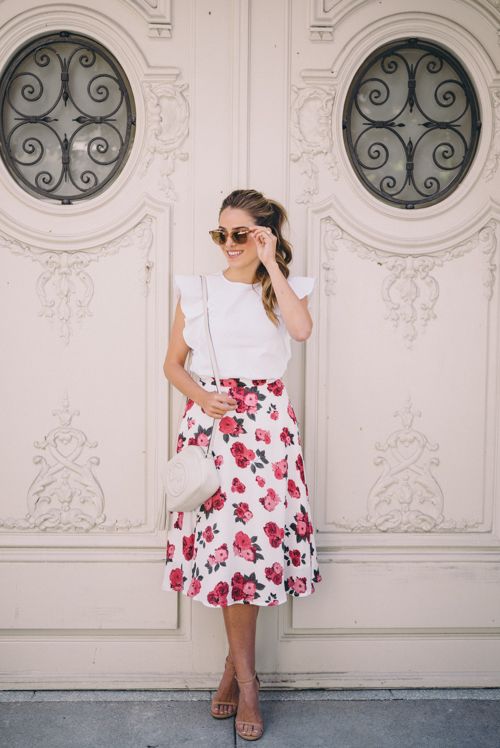 a romantic vintage outfit with a white ruffle top, a floral print skirt, tan shoes and a white bag