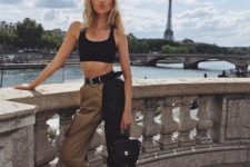 a statement outfit with a black bra crop top, two tone cropped pants, black vintage shoes and a blaack bag