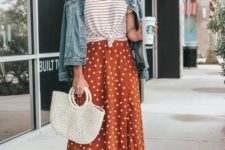 a trendy summer look with a striped tied up tee, a rust polka dot midi, tan heels and a blue denim jacket