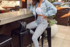 a white crop top, printed high waisted pants, a cropped denim jacket and white sneakers