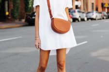 a white mini shirtdress, blush ankle strap shoes and a brown saddle bag for every day