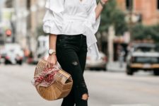 a white off the shoulder puff sleeve blouse, black ripped jeans, black block heels and a wooden bag