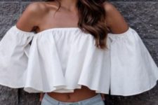 a white ruffle off the shoulder crop top and light blue ripped skinnies for a sexy look