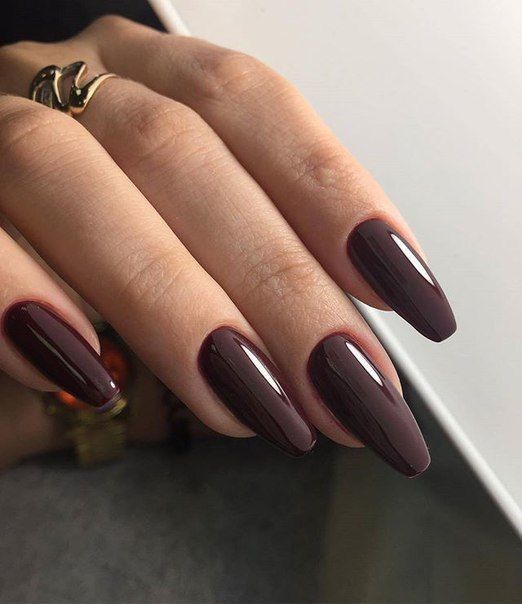 long chocolate brown nails of a coffin shape are a refined and stylish solution for now