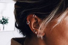 15 multiple lobe piercings and a double helix piercing with matching silver hoops