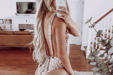 16 soft-looking beige and rose leopard print one piece swimsuit with an open back