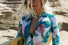 24 a surfer long sleeve swimsuit with a bright tropical print is a cool and bold idea