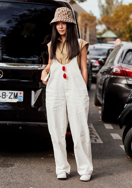 With beige shirt, white shoes and white loose jumpsuit