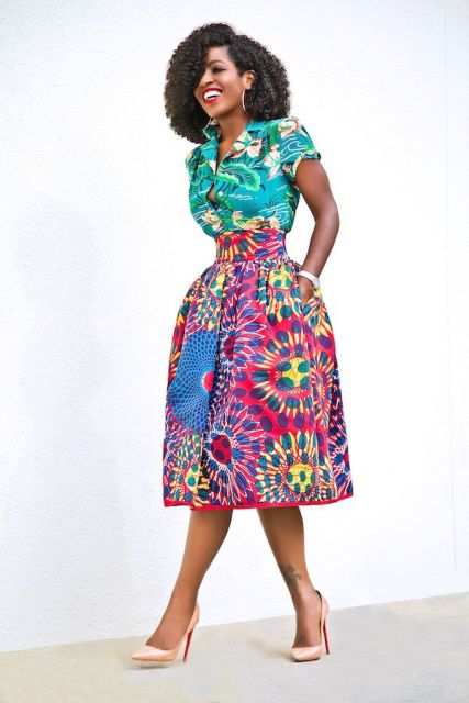 With colorful printed midi skirt and beige high heels