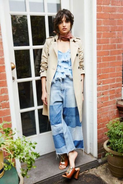 With denim ruffled top, beige trench coat and brown heeled mules
