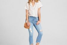 With distressed cropped jeans, brown bag and beige flat shoes