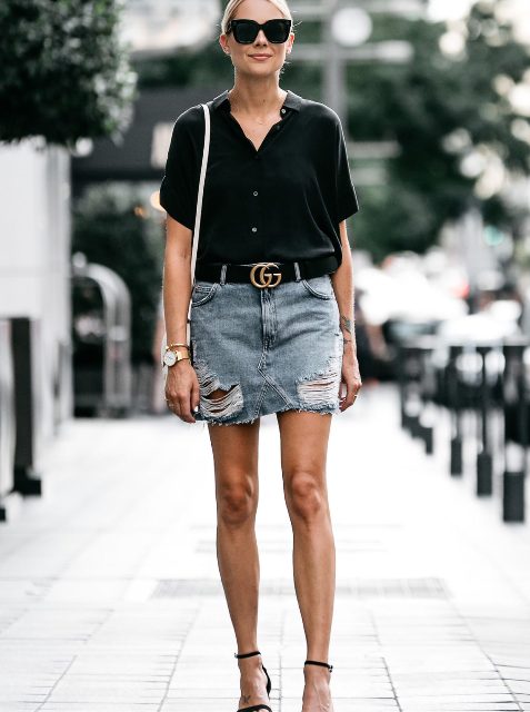 With distressed denim mini skirt, black belt, black ankle strap shoes and white bag