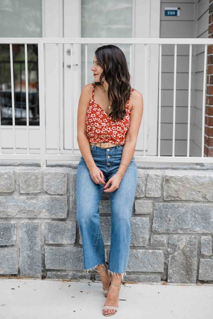 With floral top and beige high heels