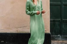 With green midi dress and embellished sandals