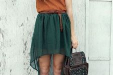 With orange top, emerald high low skirt and brown shoes