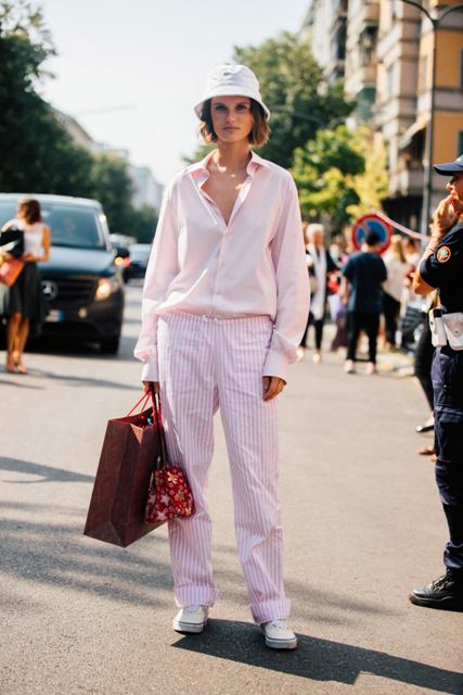 With striped pants, printed bag, white shoes and pale pink button down shirt