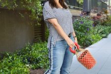 With striped t-shirt, brown bag and black shoes