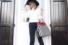 With white shirt, printed cropped pants, black hat and black shoes