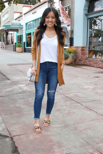 With white t-shirt, distressed jeans, brown cardigan and gray bag