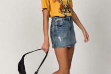 With yellow t-shirt, waist bag, white socks and black lace up boots