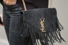 a black suede crossbody bag with long fringe is a nice accessory to carry this fall