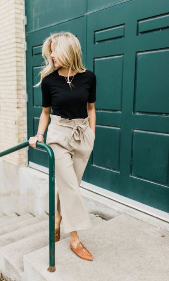 a black tee, neutral paperbag wideleg pants and leather mules for a comfortable and trendy look