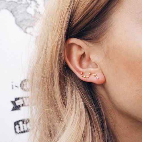 a constellation gold and rhinestone climber earring wil help you give a celestial touch to the look