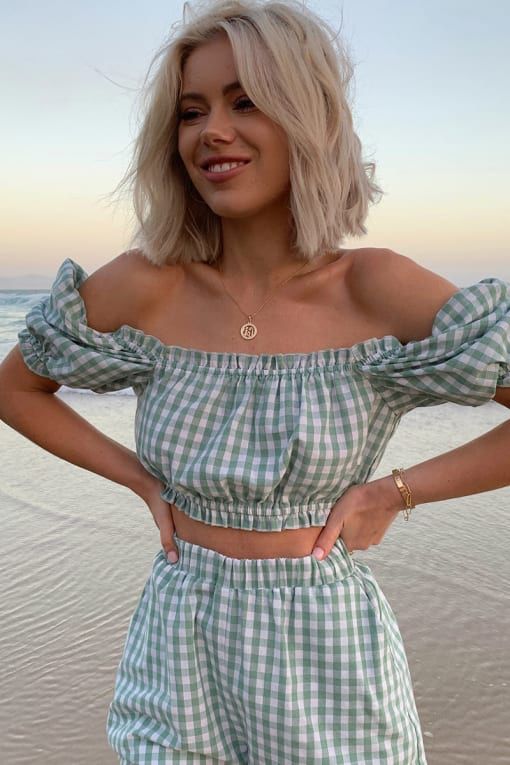 a cool green plaid set with an off the shoulder crop top with puff sleeves and high waisted shorts