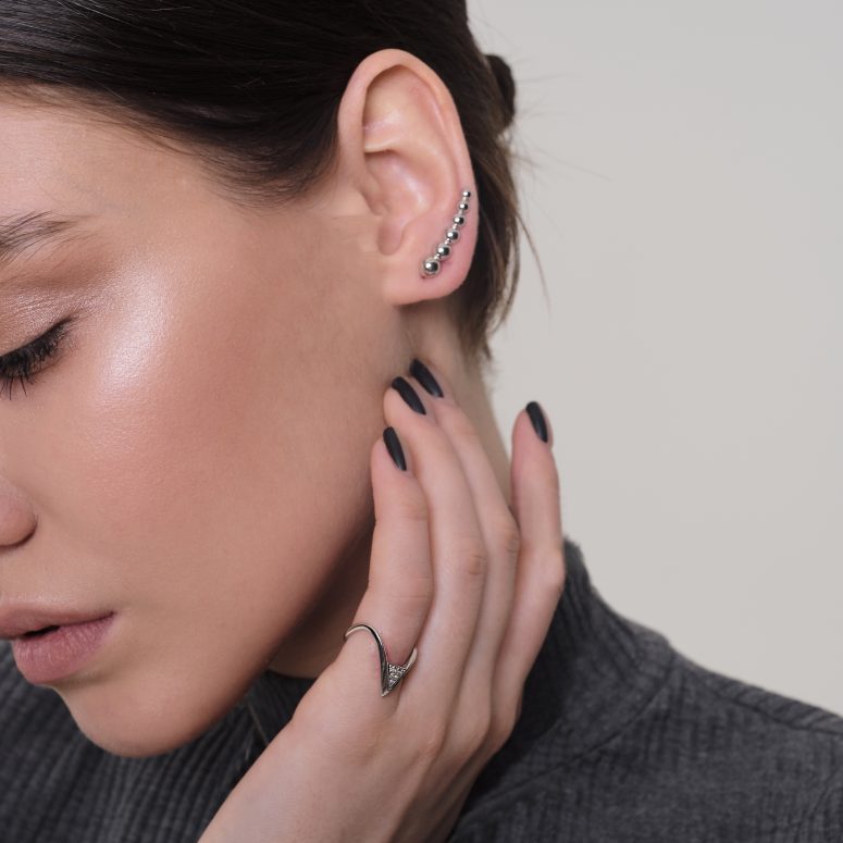 a minimalist silver stud climber earring is a nice accessory for a minimalist look and it will fit many situations