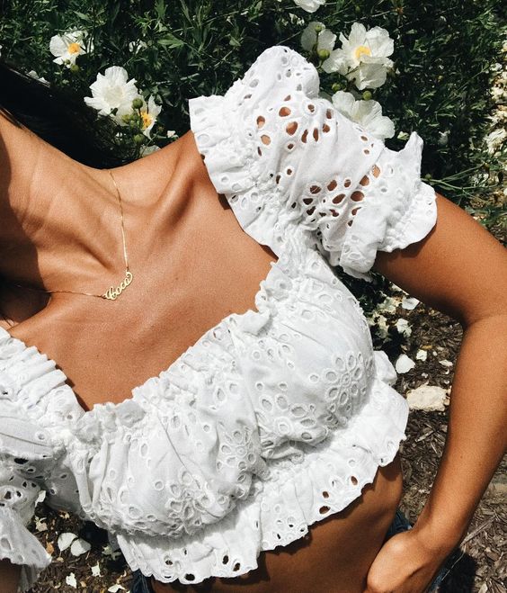 a romantic white lace crop top with a square neckline and puff sleeves is ultimately trendy