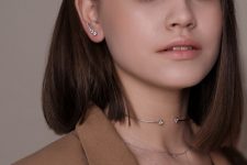 a silver and rhinestone climber earring plus a matching silver choker necklace for a super bold look