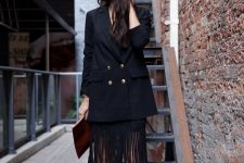 a special date look with a black top and fringe midi skirt, strappy heels and an oversized blazer
