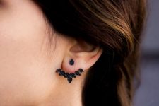 a statement leaf-shaped black crystal ear jacket looks bold and catchy and stands out a lot