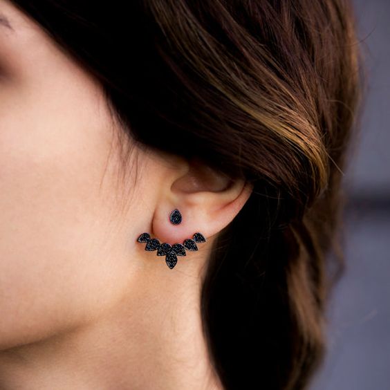 a statement leaf-shaped black crystal ear jacket looks bold and catchy and stands out a lot