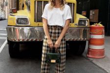 a white tee, plaid pants, black velvet heels and a chic black leather top handle bag