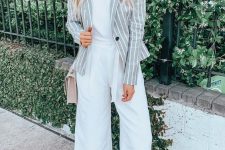 a white tee, white culottes, neutral block heels, a pink bag and a striped gray and white blazer
