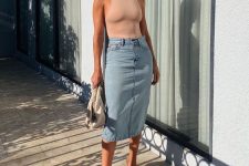 an edgy look with a blush halter top, denim midi, sheer net shoes and a white clutch