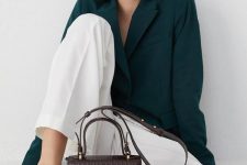 an oversized hunter green blazer, white pants, black shoes and a chocolate brown snakeskin top handle bag