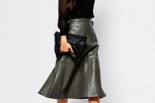 With black V-neck blouse, black leather clutch and black cutout boots