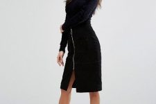 With black long sleeved shirt and black ankle strap high heels