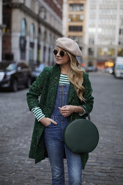 With denim jumpsuit, striped shirt, green coat and green rounded bag