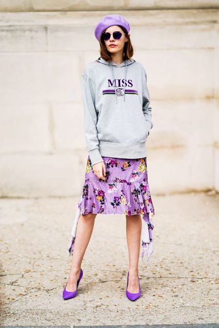 With hoodie, floral skirt and lilac pumps