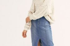 With loose sweater and brown suede boots