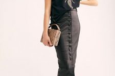 With loose t-shirt, snake printed bag and black sneakers