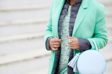 With mint green lace midi dress, rounded leather bag and mint green coat
