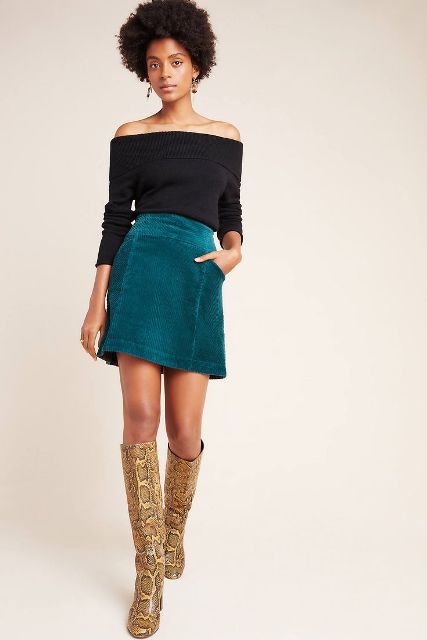 With off the shoulder top and snake printed high boots